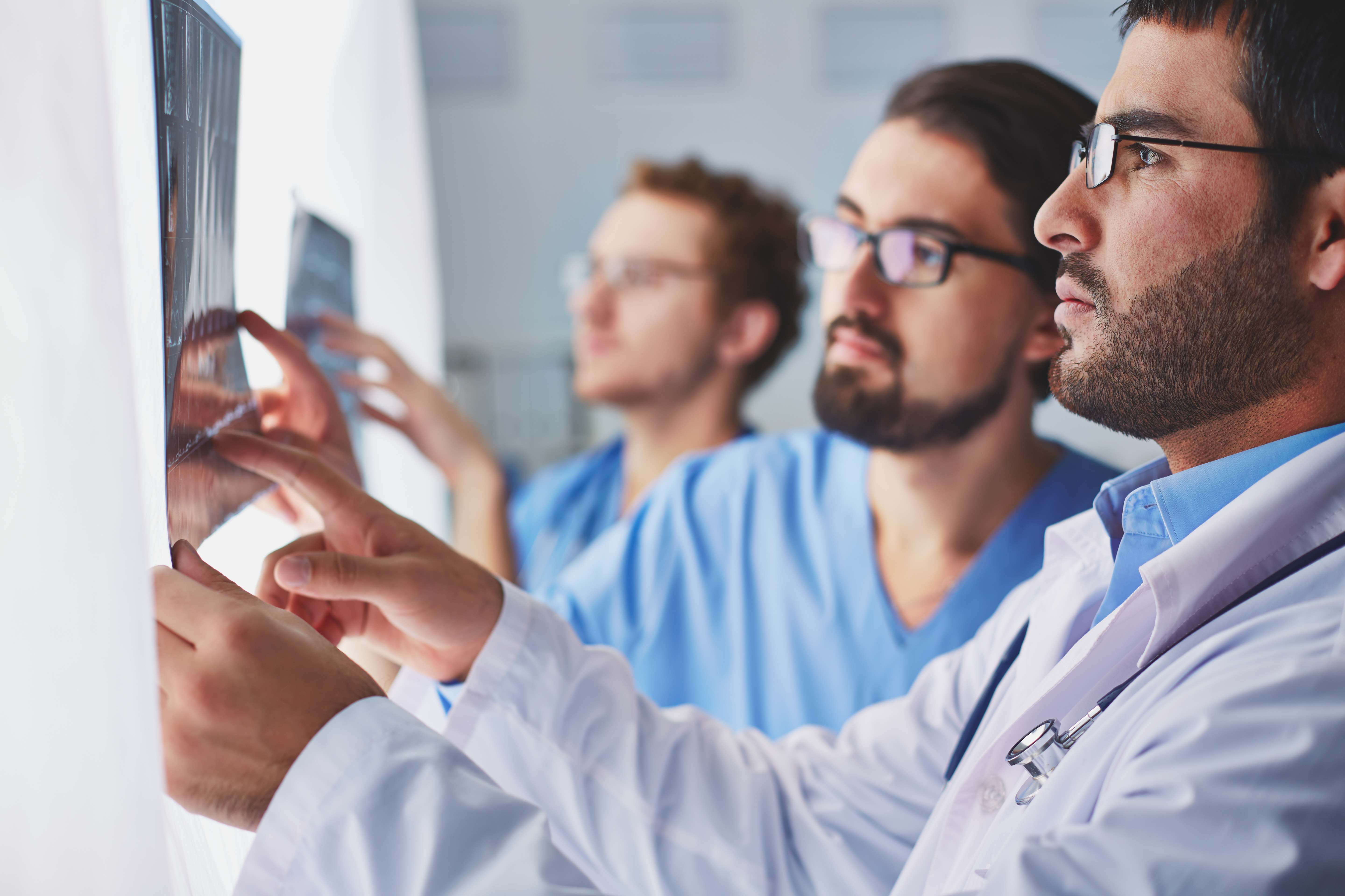 Doctors analyzing an X-ray image